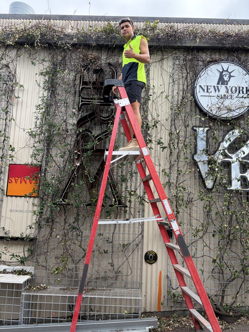 BrightHome removing vines during a commercial exterior clean-up in Stafford